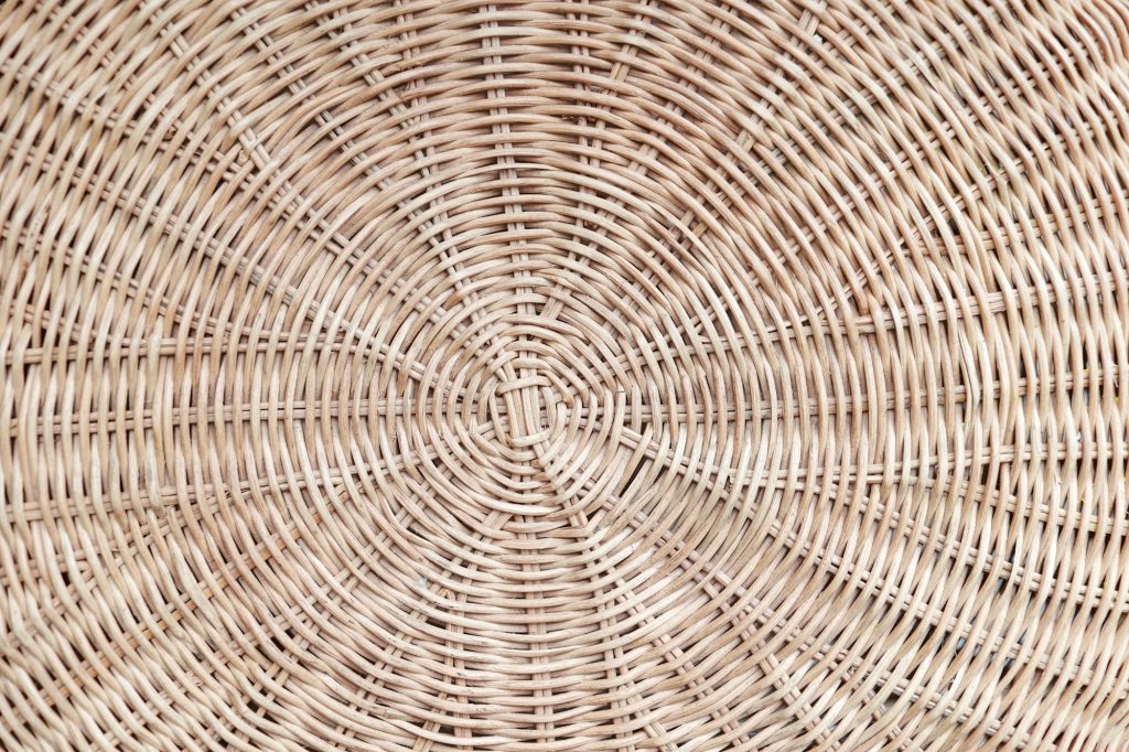 Circular weave rattan pattern, round rattan furniture background light brown texture, weave rattan